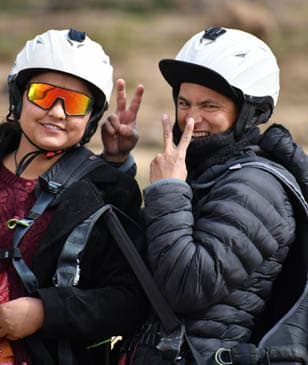Two happy fliers smiling after a flight